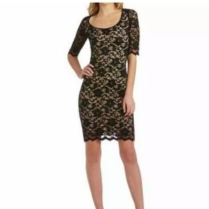 Black lace cocktail dress with nude underlay